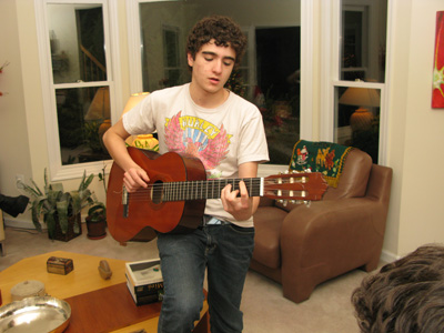 Alec playing guitar at home in December