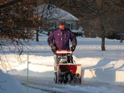 Mauricio clearing the snow from the driveway