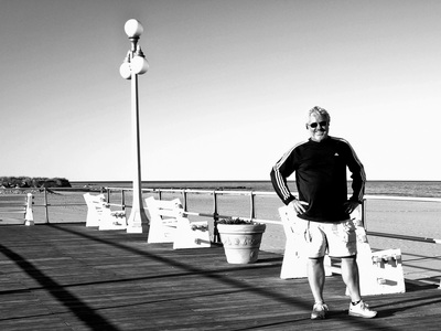 Mauricio walking on the boardwalk at Avon by the Sea in April