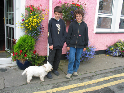 Alec, Adam, and a dog in Scotland.