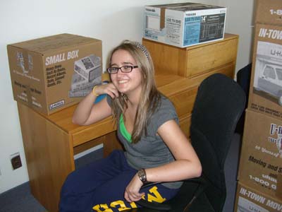 Sasha at desk in new room in Ann Arbor