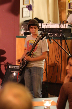 Alec playing bass at the Internet Café in Red Bank